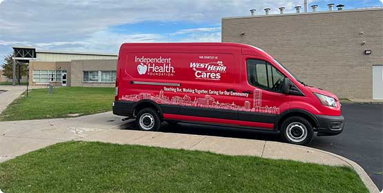 IHA van parked at a school